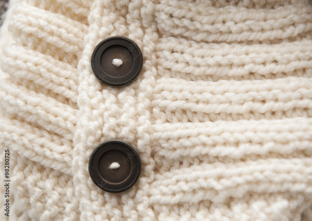 texture of white knitted soft sweater with buttons texture of white knitted soft sweater with buttons