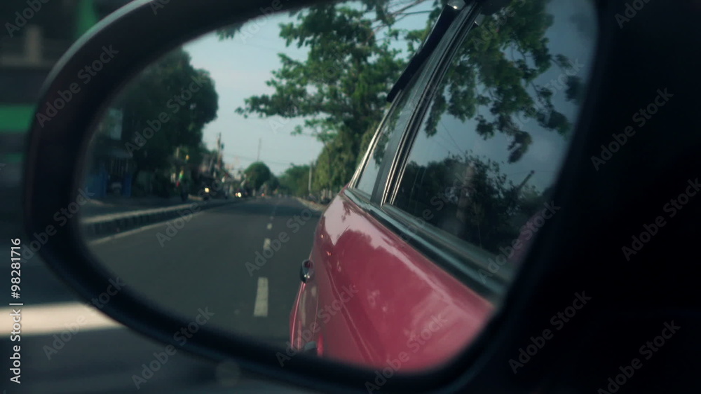 Car driving through the city in the mirror
Car driving through the city in the mirror