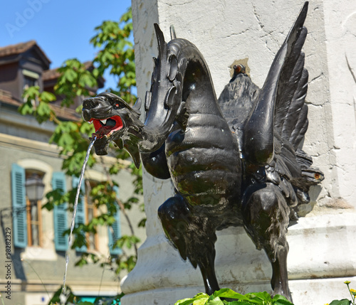 Close-up of dragon on a fountain in a Geneva Switzerland town square.