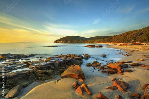 Sunset in Cala Violina bay beach in Maremma, Tuscany. Mediterran photo