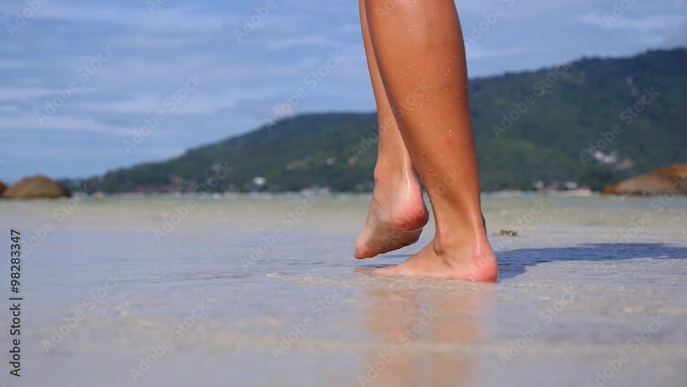 Barefoot Female Legs Step in Sea at Beach Barefoot Female Legs Step in Sea at Beach