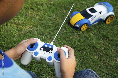 Remote control toy car with a boy.