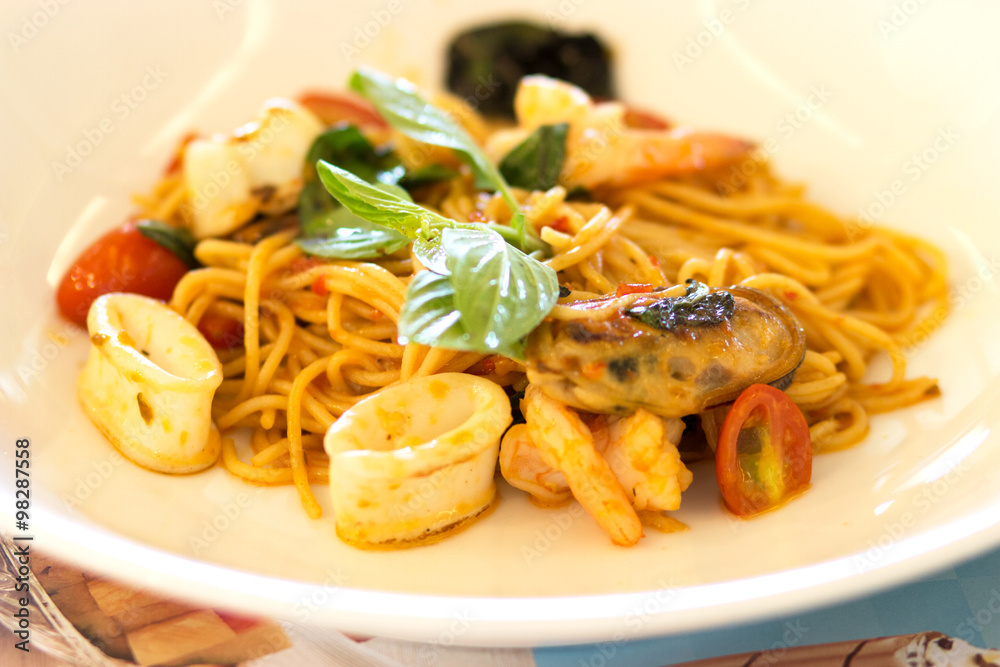 Spaghetti seafood with tomato sauce , Italian food soft focus