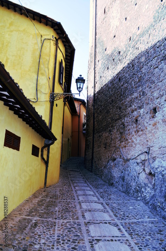 Fototapeta Naklejka Na Ścianę i Meble -  Wonderful street in small medieval town in sunny day