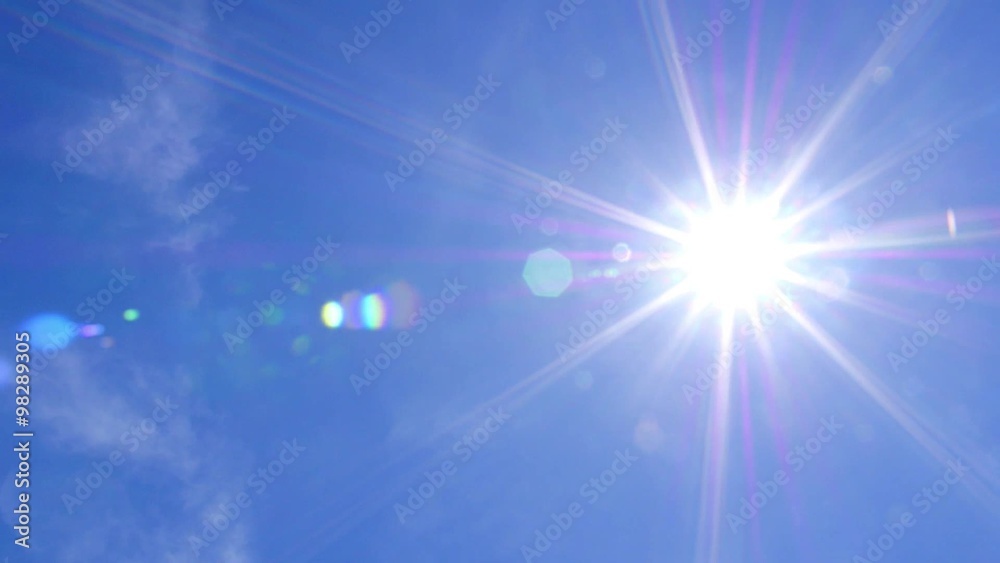 Blue Sky and Sun with Lens Flare Blue Sky and Sun with Lens Flare
