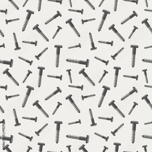Seamless vector pattern with tools. Chaotic background with screws on the grey backdrop.