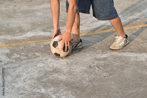 fell vacant soccer ball on concrete floor (street soccer)