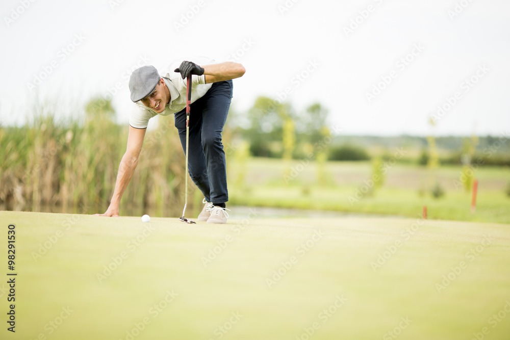 Young man playing golf Young man playing golf