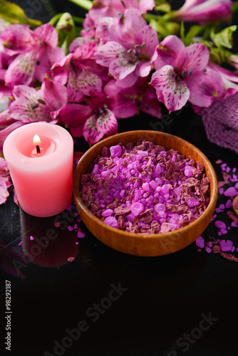 Spa background-branch orchid, candle, petals in bowl