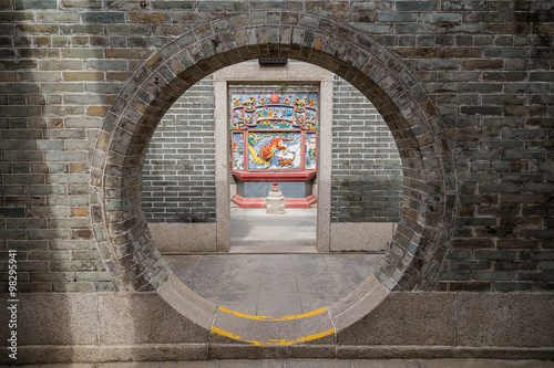 Round doorway at the Pak Tai Temple on Cheung Chau Island in Hong Kong, China, viewed from the front.