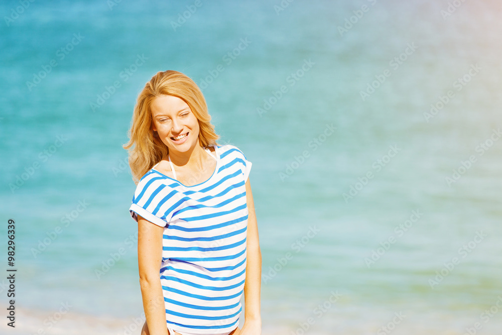 Young woman relaxing on the beach Young woman relaxing on the beach