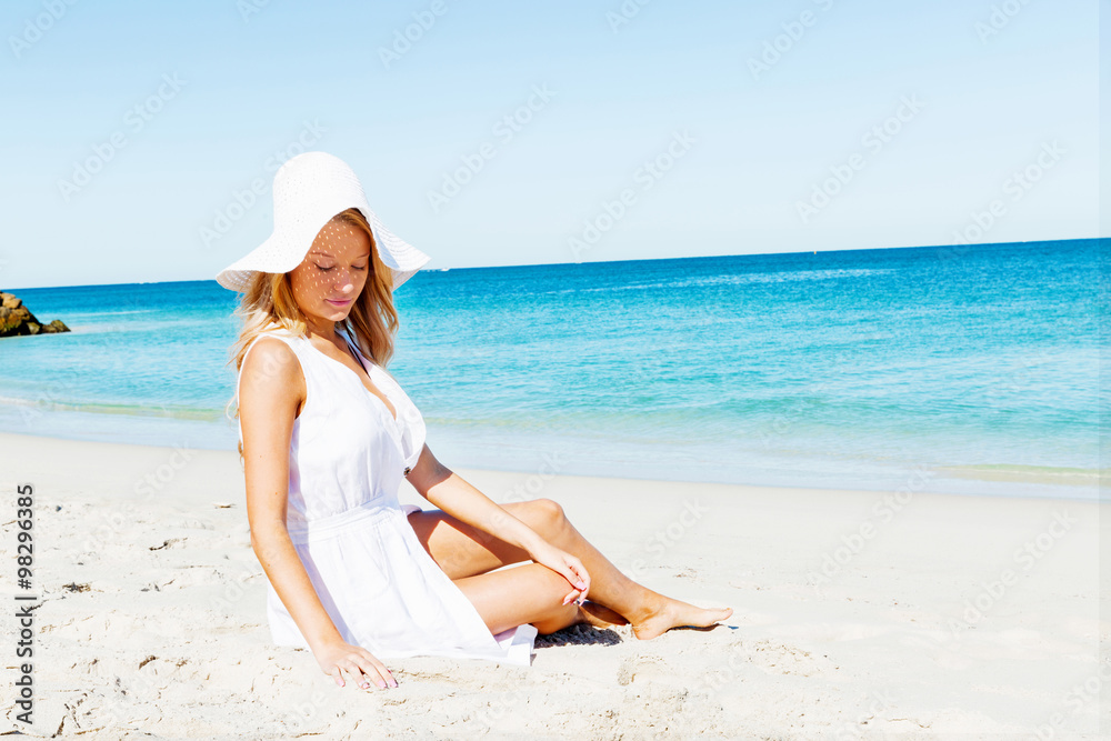 Young woman relaxing on the beach