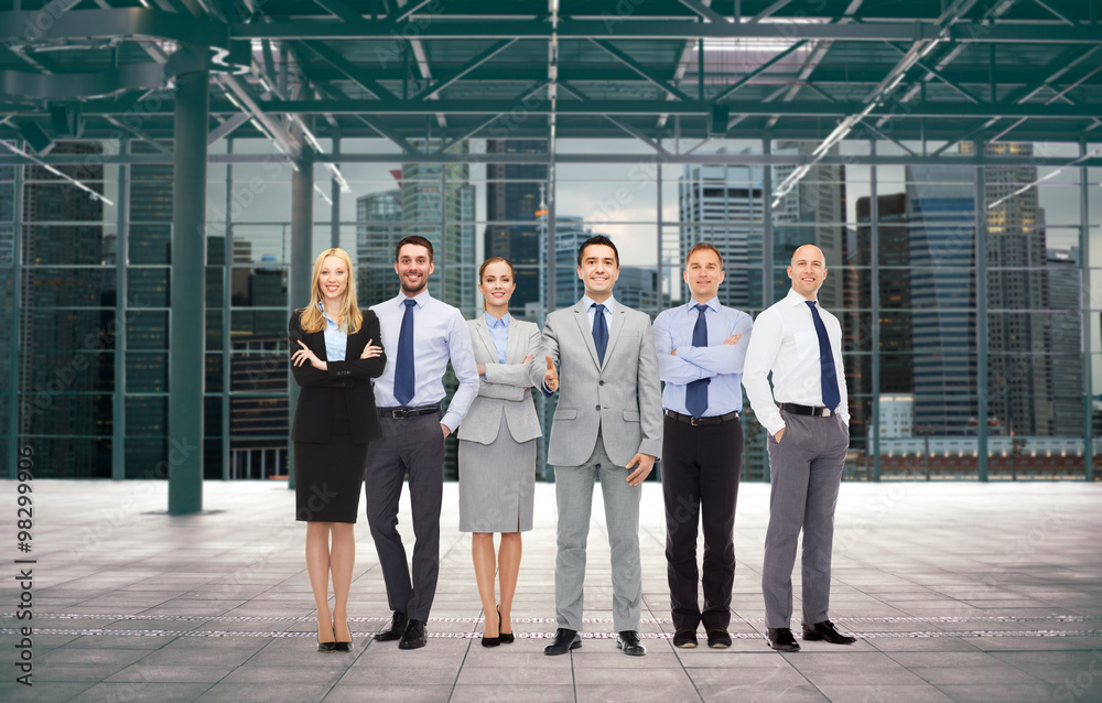 group of smiling businesspeople over office room group of smiling businesspeople over office room