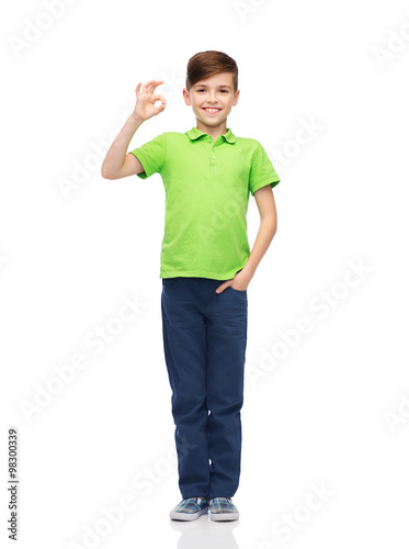 happy boy in white t-shirt showing ok hand sign