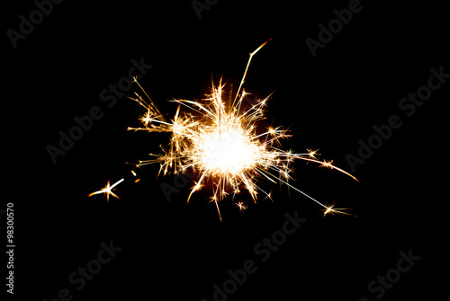 sparkler or bengal light burning over black