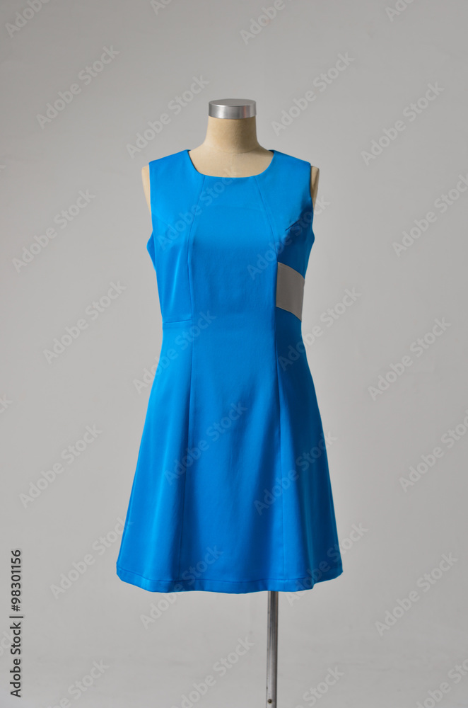 female sundress clothing with scarf on display