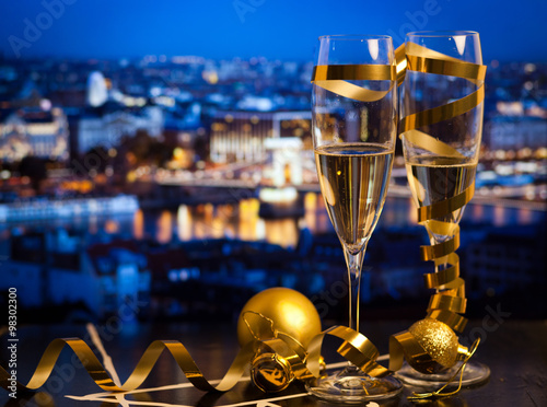 New Year in Budapest - Champagne glasses and Budapest parliament with fireworks in the background