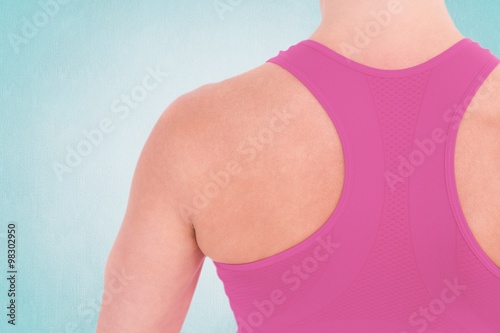 Composite image of back view of muscular woman 