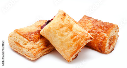 Fresh puff pastries with cherry jam isolated