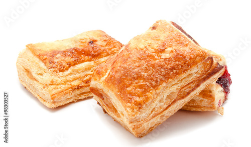 Fresh puff pastries with cherry jam isolated photo