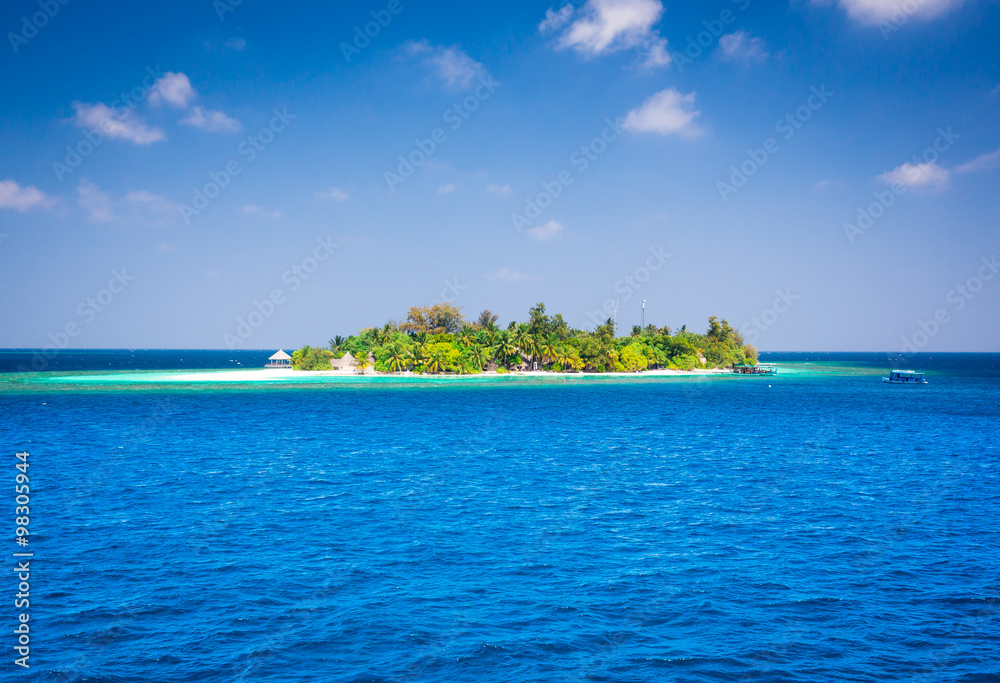The solitary island and bungalows in the sea .