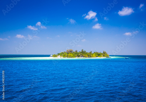 The solitary island and bungalows in the sea . © oleg_mj
