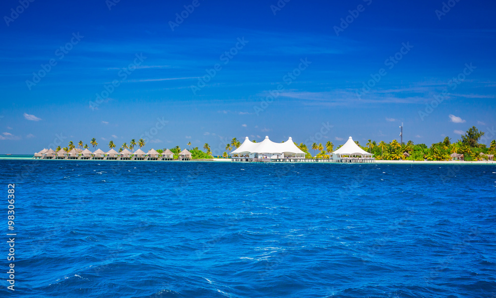 Fototapeta premium The solitary island and bungalows in the sea .