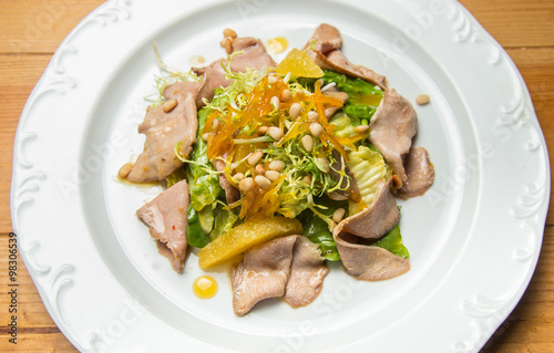 Warm salad with beef and sesame seeds