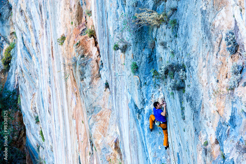 Bright luminous orange blue Rock pattern and Climber