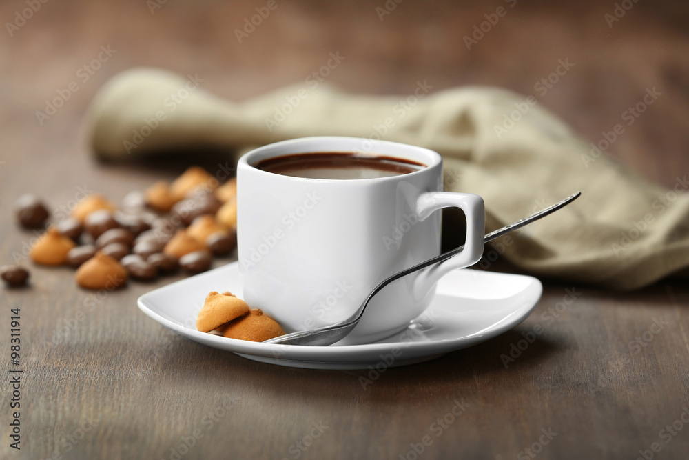 Fototapeta premium Cup of cacao with biscuits on wooden background