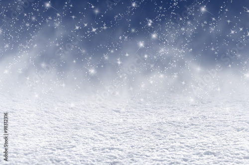 Winter christmas background with shiny snow and blizzard photo