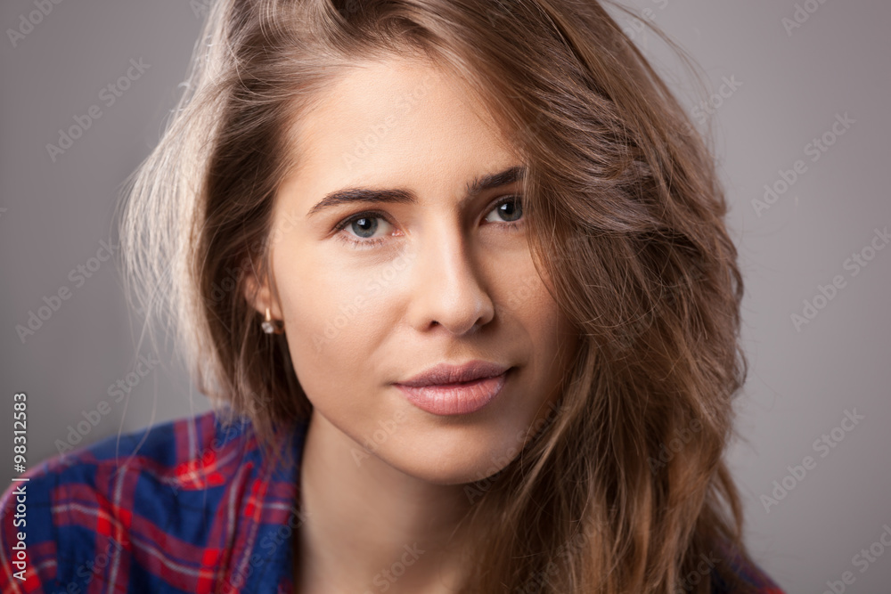 Studio portrait of happy young woman. Studio portrait of happy young woman.