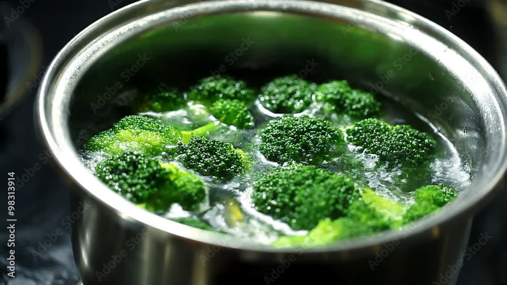pieces of broccoli in boiling water