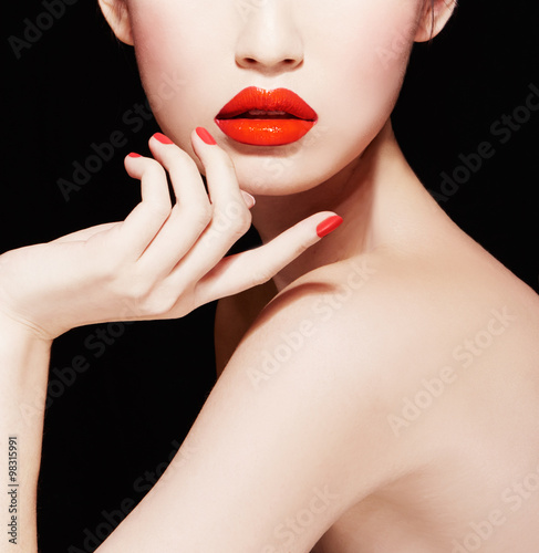 Wallpaper Mural Beautiful skin woman with red lips and nails isolated on black background. Body care, Makeup. Torontodigital.ca