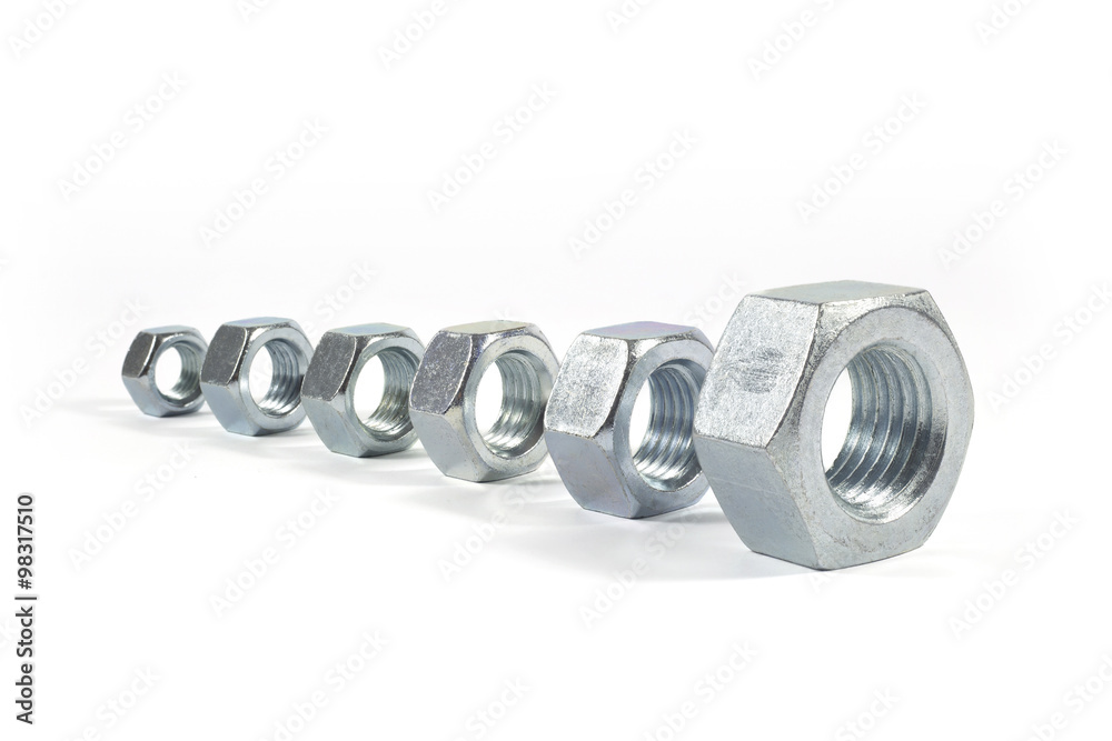 Metal Nuts Lined Up From Smallest To Largest Isolated On White Metal Nuts Lined Up From Smallest To Largest Isolated On White
