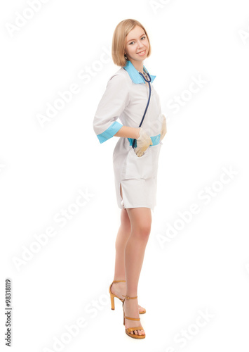 Woman doctor in white lab coat standing on white background.