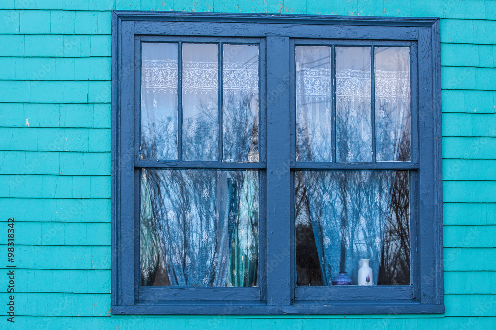 colourful window with curtains and reflection by the Nova Scotia coast colourful window with curtains and reflection by the Nova Scotia coast