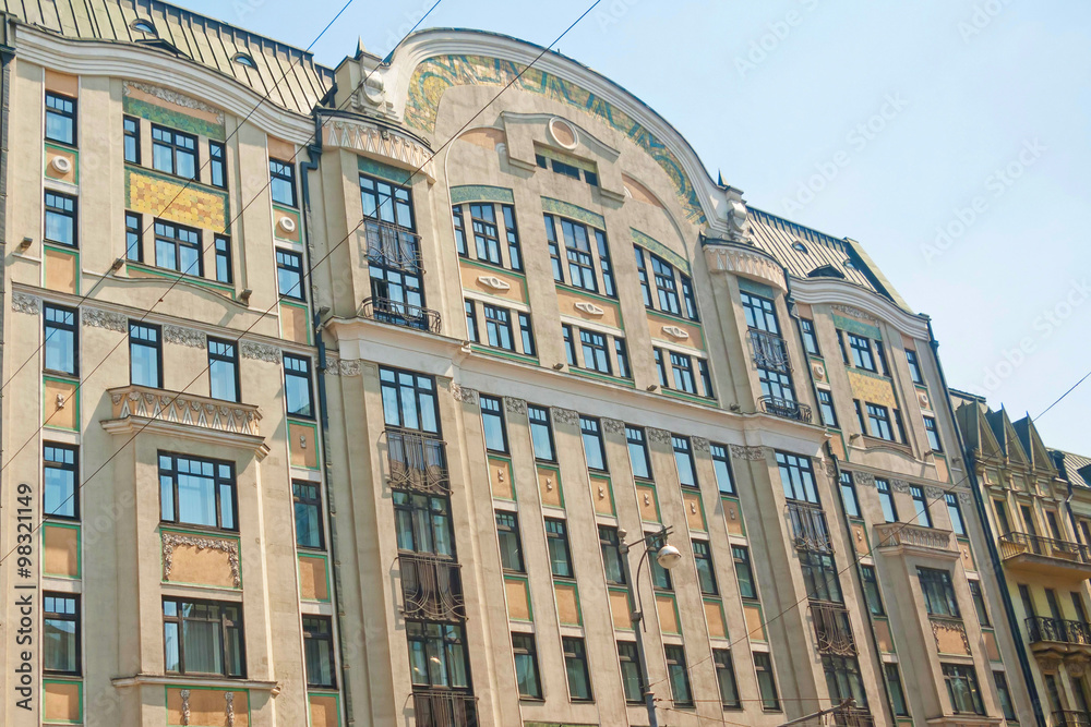 Fototapeta premium Building façades with stucco molding and bars balconies. Moscow, Russia. 
