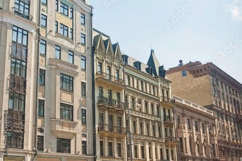 Building fa  ades with stucco molding and bars balconies. Moscow  Russia.   