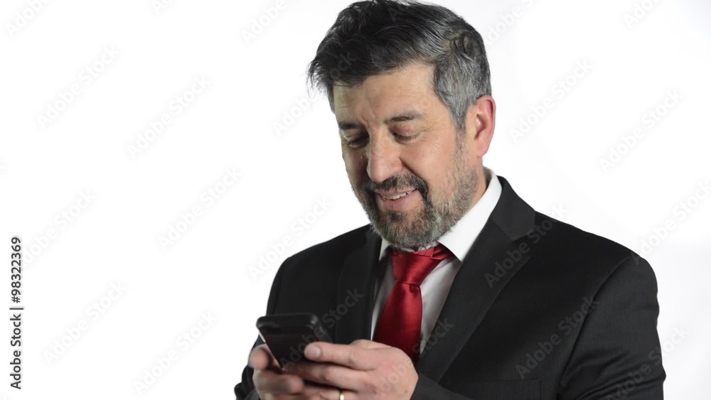 Hispanic businessman using cellphone over white background Hispanic businessman using cellphone over white background