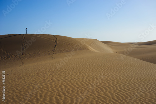 Reaching the climax / Peak of a large sandy dune in a wide dessert of Gran Canaria