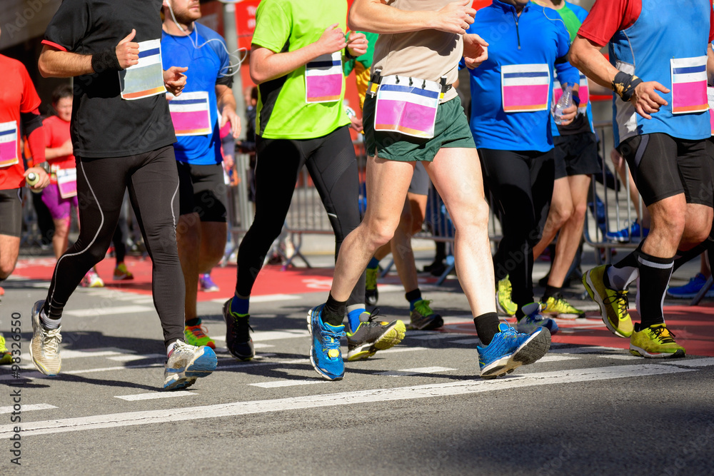 Marathon running race, runners feet on road, sport, fitness and healthy lifestyle concept
Marathon running race, runners feet on road, sport, fitness and healthy lifestyle concept