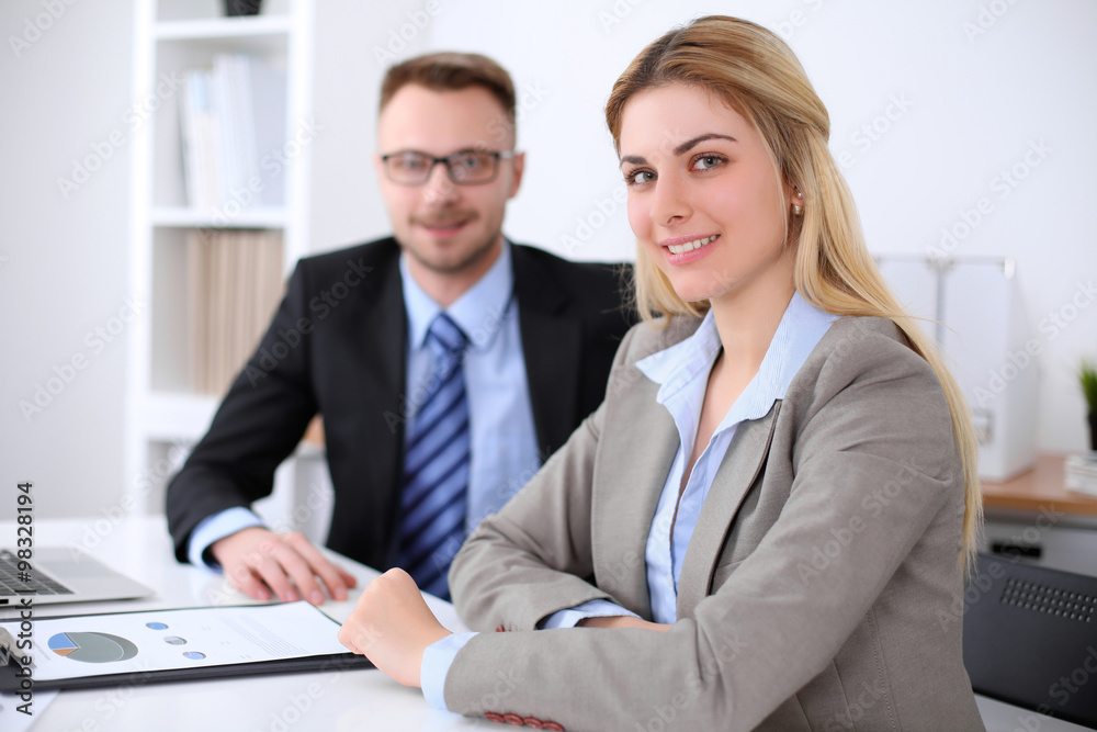 Two successful business partners working at meeting in office Two successful business partners working at meeting in office