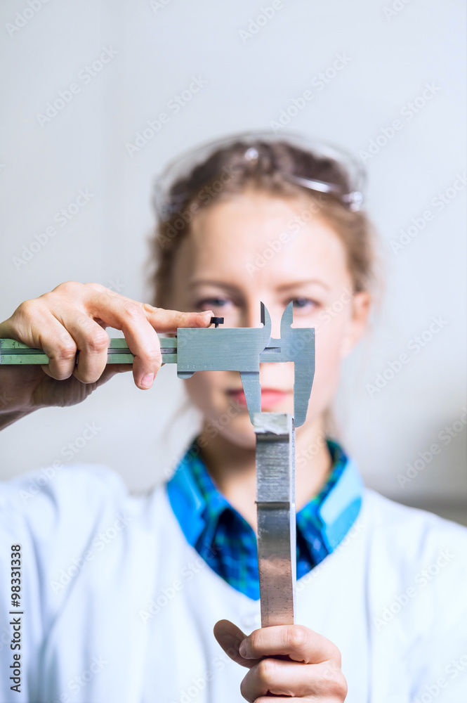 Woman engineer detail measure caliper Woman engineer detail measure caliper