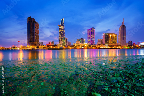 Downtown Saigon in twilight (view from Thu Thiem district) (HDR), Ho Chi Minh city, Vietnam. Saigon is the largest city and economic center in Vietnam with population around 10 million people.