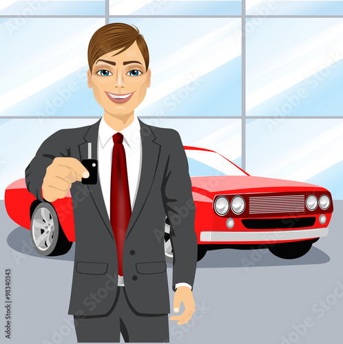 automobile salesman holding the key