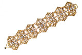 Gold bracelet with diamonds on a white background