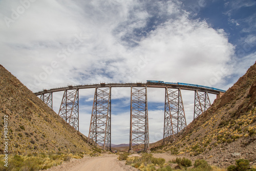 Train driving over Polvorilla Viaduct in Argentina
