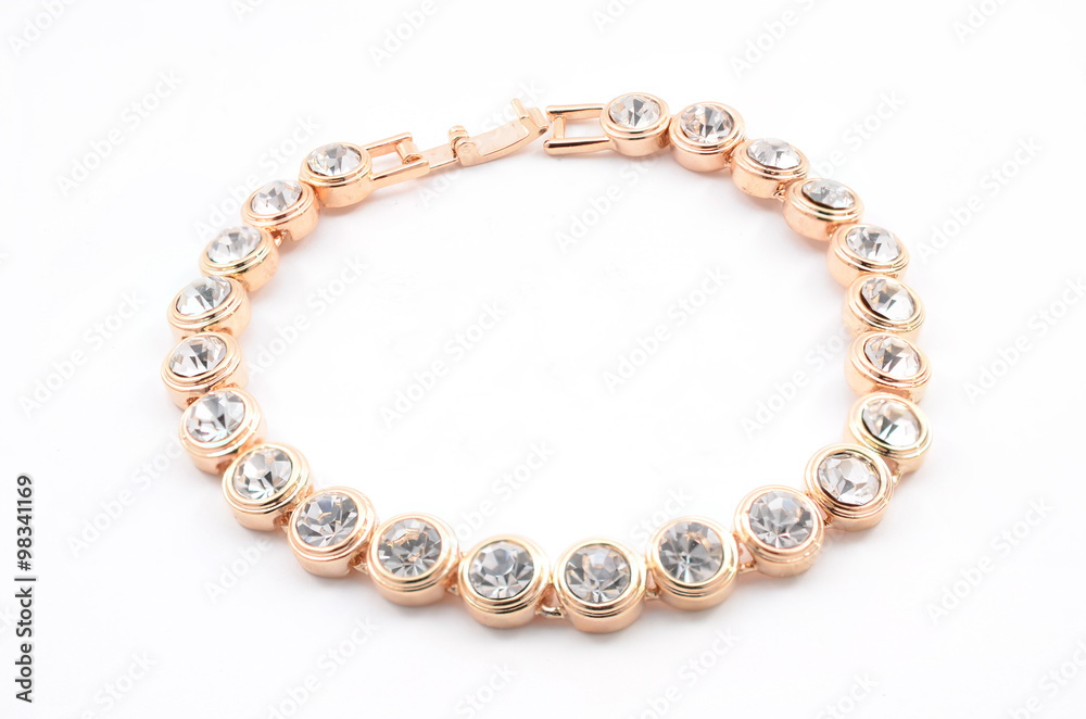 Obraz premium thin gold bracelet on a white background