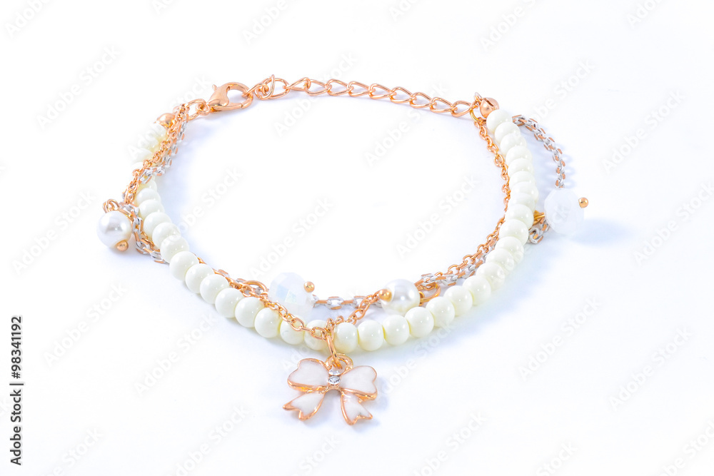 bracelet with pearls and pendants isolated on white bracelet with pearls and pendants isolated on white
